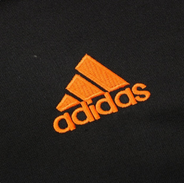Real Madrid Black and Orange Chándal